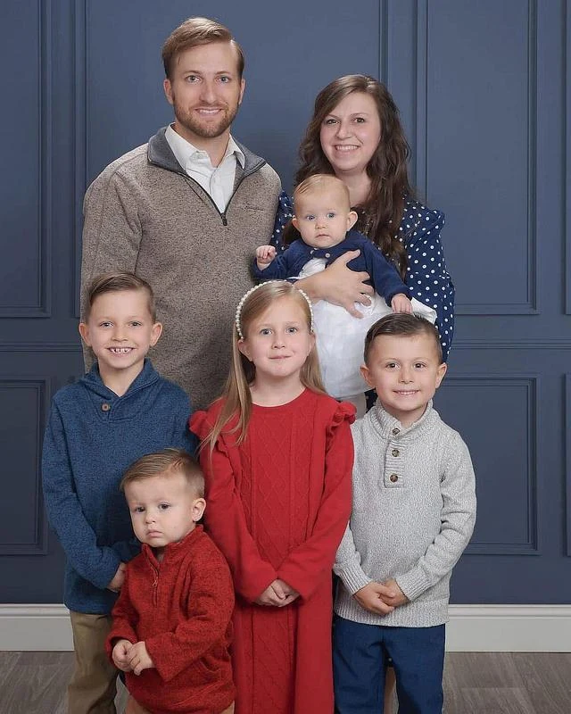 Pastor Marcus Heffernan with his family, photographed together in Midland’s official church gallery.
